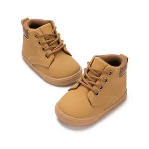 Detail view of khaki PU leather toddlers ankle boots with round laces and anti-slip sole