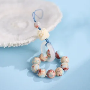 Ciondolo danza del leone con perle di pietra Shoushan da 10 mm e intaglio in avorio vegetale