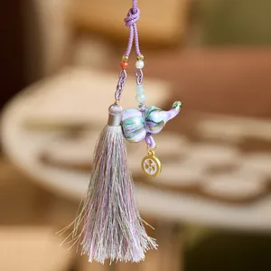 Pendentif éléphant en céramique de style chinois avec pompon dégradé violet