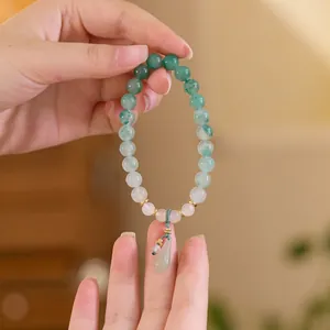 Jade-Perlenarmband mit grünem Wassertropfen-Anhänger und Goldakzenten für Damen