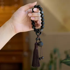 Bracciale in ossidiana naturale con ciondolo Pixiu nero e nappa di seta marrone