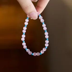 Pink cat eye stone beaded bracelet with turquoise blue accents for women