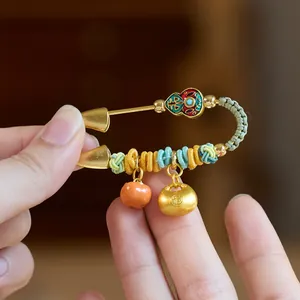Handmade Chinese zodiac horse brooch with gold safety pin, enamel decor, and lucky charms