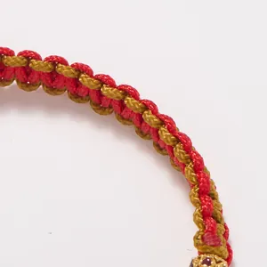 Bracelet tressé rouge et or avec tissage en spirale pour porter bonheur l'année du cheval