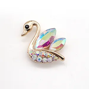 Golden swan shoe charm accessory with iridescent gems and colorful crystals for clogs