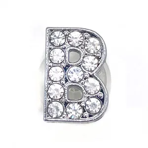 Close-up of sparkling silver letter B shoe charm accessory set with clear rhinestones