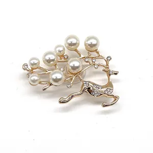 Elegant gold reindeer shoe charm with white pearls and sparkling crystal accents