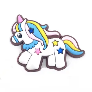Detail view of cute 3D PVC unicorn shoe charms with colorful mane for clog decoration