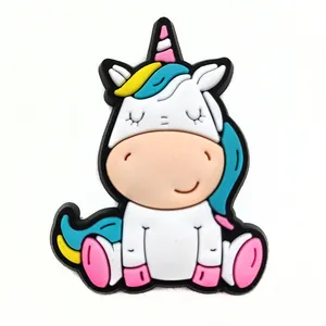 Close-up of cute cartoon unicorn PVC charm for garden clogs and sandals decoration