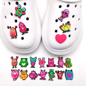 Colorful monster themed charms for clog shoes featuring cute cartoon designs for DIY decor