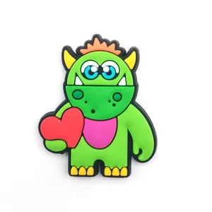Green cartoon monster shoe charm with red heart detail for Valentine's Day clogs