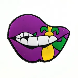 Close-up of purple Mardi Gras biting lips PVC shoe charm for clogs and sandals