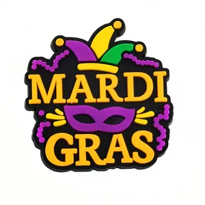 Detailed view of Mardi Gras themed PVC shoe charms with mask and crown motifs