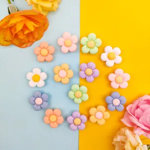 Colorful resin flower charms for clog shoes in vibrant macaron shades and yellow centers