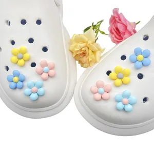 Flower resin shoe charms in pastel colors for clogs showing the decorative floral buckle