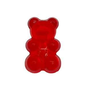 Detail of a red translucent gummy bear charm for garden shoe DIY decoration