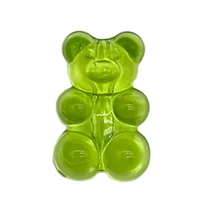 Macro view of transparent green resin bear charm for garden clogs shoe decoration
