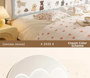 Detail of cream headboard cover with cute dog patterns and floral bedding accents