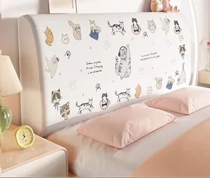 Detail of soft cream boucle headboard cover featuring cute cartoon cat illustrations