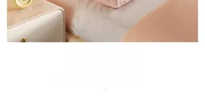 Close-up of soft pink fabric texture on modern headboard cover in a bedroom setting