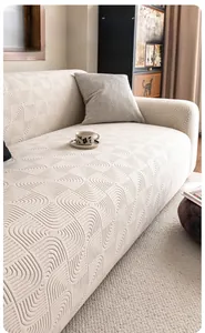Close-up of cream textured polar fleece sofa cover with geometric 3D wave pattern