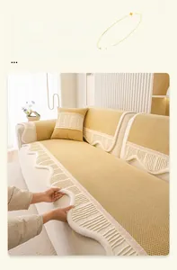 Detail of scalloped edge velvet sofa cover with thick plush trim and wavy texture