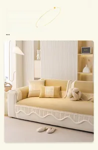 Close-up of cream corduroy sofa cover with textured waffle pattern and ruffled edges