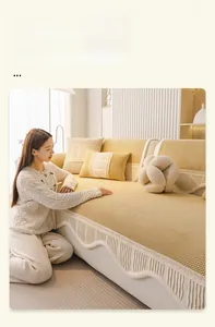 Detail of warm yellow corduroy sofa cover with elegant wavy ruffled edges for winter