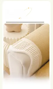 Close-up of beige corduroy sofa cushion featuring cream plush pleats and textured knit fabric