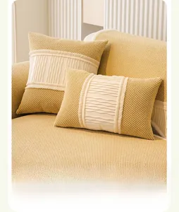 Detailed macro view of beige corduroy sofa cushion with elegant ruffled white fabric trim
