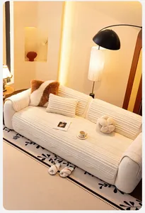 Detailed texture of thick cream flannel sofa cover with striped quilting and soft finish