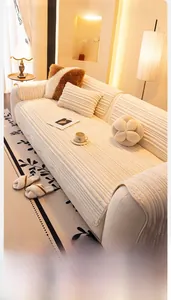 Close-up of cream flannel sofa cover with thick vertical corduroy texture and soft pillows