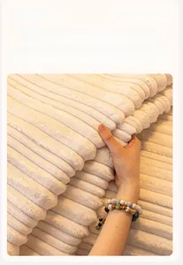 Close-up of thick cream flannel sofa cover featuring a soft striped texture fabric