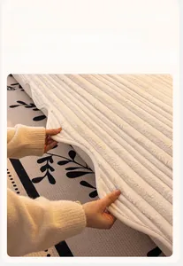 Detailed close-up showing shaped edging and soft striped velvet texture of cream sofa cover