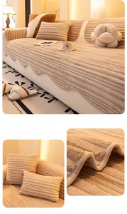 Detail of khaki corduroy sofa cover with wavy edges and decorative flower pillow