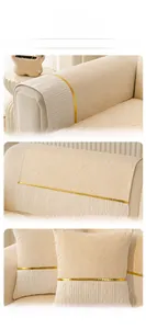 Detailed view of chenille sofa cover with wavy texture and gold mirror trim accents