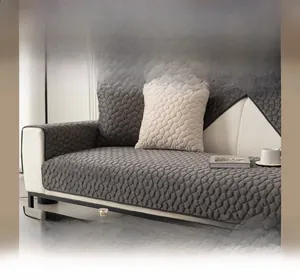 Detailed view of quilted shu velveteen sofa cover with modern geometric texture