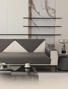Detail of dark grey quilted flannel sofa cover with 3D honeycomb anti-slip pattern