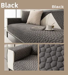 Macro detail of quilted velvet sofa cover with geometric honeycomb texture in dark black