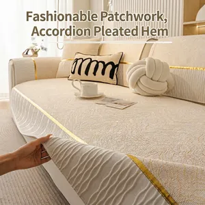 Luxurious cream chenille sofa cover featuring golden trim and elegant accordion pleated hem