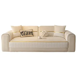 Luxury cream chenille sofa cover with golden trim and elegant wavy jacquard pattern