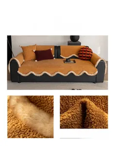 Detail of plush orange sofa cushion cover with off-white wavy faux fur trim and soft texture