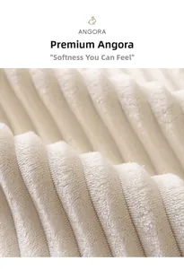 Close-up of premium ribbed angora rabbit fleece texture in creamy white plush fabric
