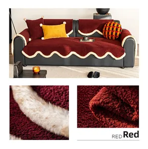 Detail of plush burgundy sofa cushion with cream faux fur wavy edges and soft texture