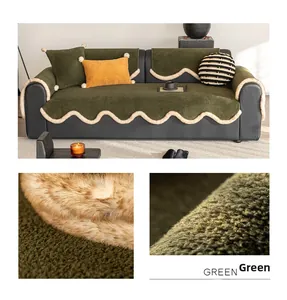 Detail of dark green plush sofa cushion with creamy white wavy faux fur trim texture