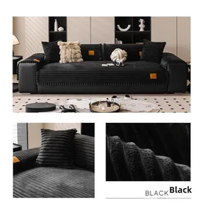 Detail of black corduroy sofa cover with striped texture and plush pom-pom fringe trim