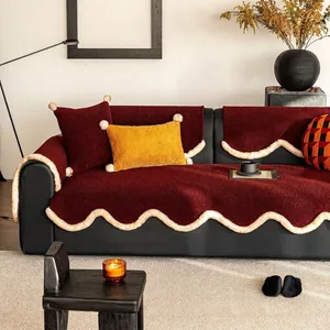Winter plush red sofa cover set with beige wavy edges and decorative pillows