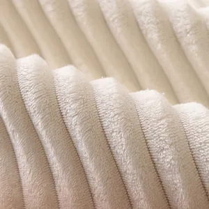 Thick faux rabbit fur chair cushion in cream with elegant vertical striped texture