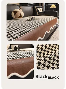 Detail view of black houndstooth sofa cushion with leather patchwork and wavy plush trim