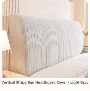 Macro detail of light grey elastic knitted headboard cover with vertical stripe texture